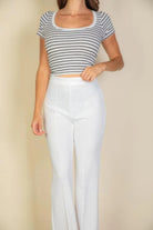 VacationGrabs women's pink flare trousers for women styled with a striped crop top