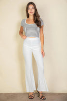 VacationGrabs women's pink flare trousers for women styled with a striped crop top and black heels