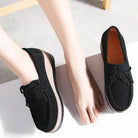 VacationGrabs black platform slip-ons for travel with fringe detail and comfortable fit