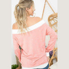 Trendy polka dot off shoulder top in coral with a relaxed fit for stylish women's wear