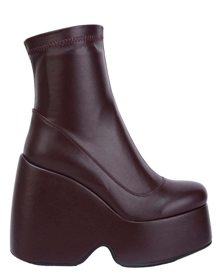 Brown platform boot on a white background