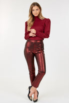 VacationGrabs women's ankle length faux leather pants in metallic red styled with a burgundy top and black heels