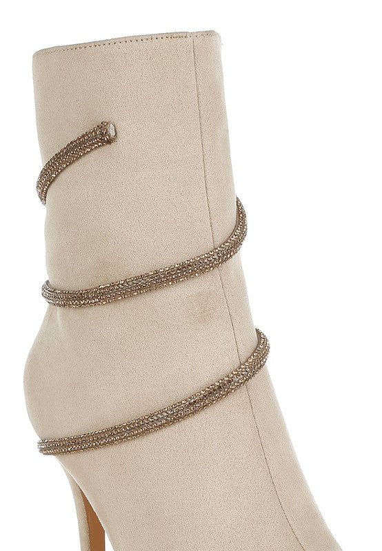 Beige ankle boot with decorative wrap-around design, perfect for pairing with stylish outfits and featuring red wrap around heeled boots