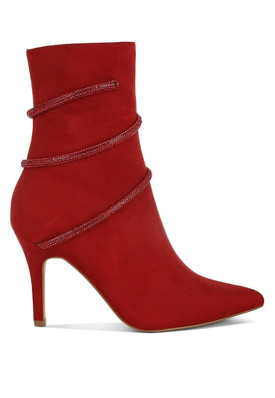 Stylish red wrap around heeled boots with a pointed toe and decorative straps for women's fashion