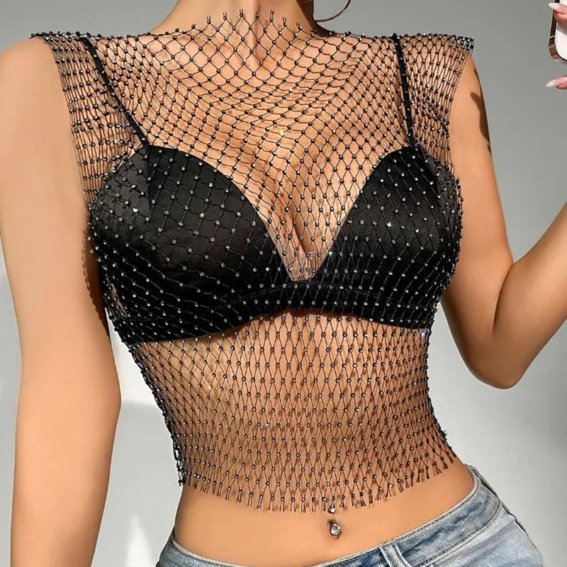rhinestone fishnet crop top shell only worn over black bra with spaghetti straps and paired with jeans