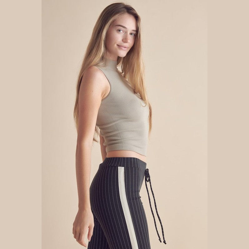 Yelete ribbed mock neck tank top in light beige, perfect for casual or sporty outfits