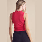 Yelete ribbed mock neck tank top in vibrant pink with a fitted design for a stylish look