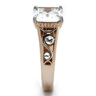 Elegant rose gold stainless steel ring featuring a large square cut stone and decorative accents