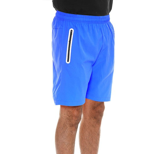 WEIV men's running shorts with zip pocket in bright blue paired with white sneakers