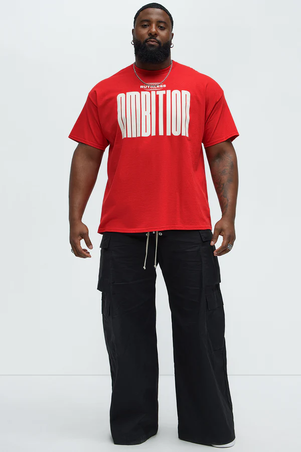 Ruthless ambition t-shirt for men in red with bold white ambition text modeled with black cargo pants