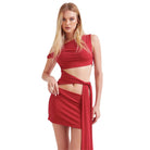 Model wearing a red sexy bandage wrap party dress with cutout details and side tie