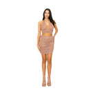 Woman wearing a sexy holiday skirt set for women featuring a halter top and ruched mini skirt in beige