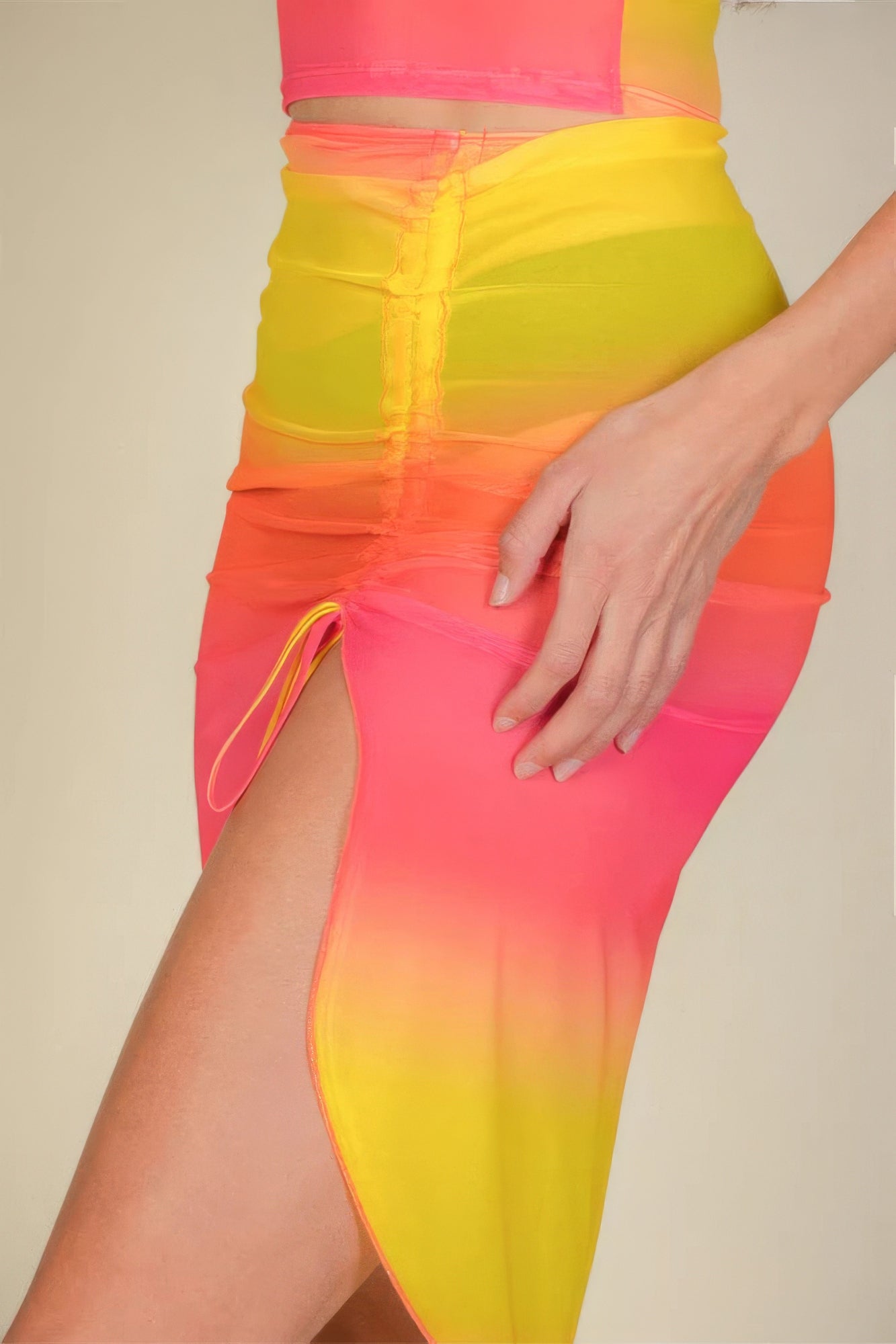VacationGrabs women's swimwear featuring a sexy sheer mesh skirt with vibrant yellow and pink gradient