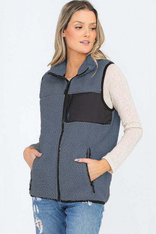 WEIV Women's Sherpa Vest for Travel in Blue with zippered pockets and a stylish design