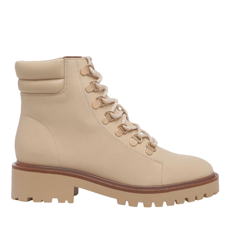 Beige boot with brown sole on a white background
