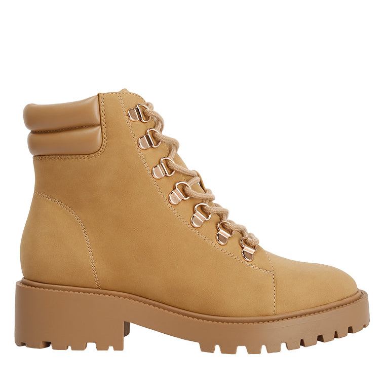 Tan boot with laces on a white background