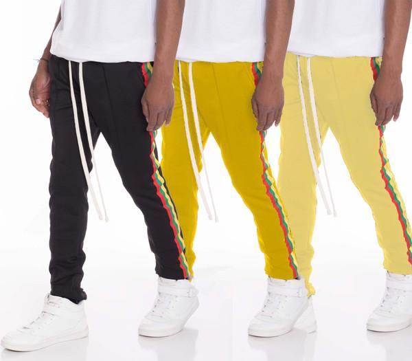 WEIV side taped track pants in black and yellow with stylish striped detailing for men