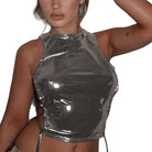Shiny silver side tie metallic tank top worn by model with sleeveless high neck design