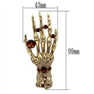 Skeleton hand brooch jewelry with intricate design and amber-colored stones for unique fashion statement