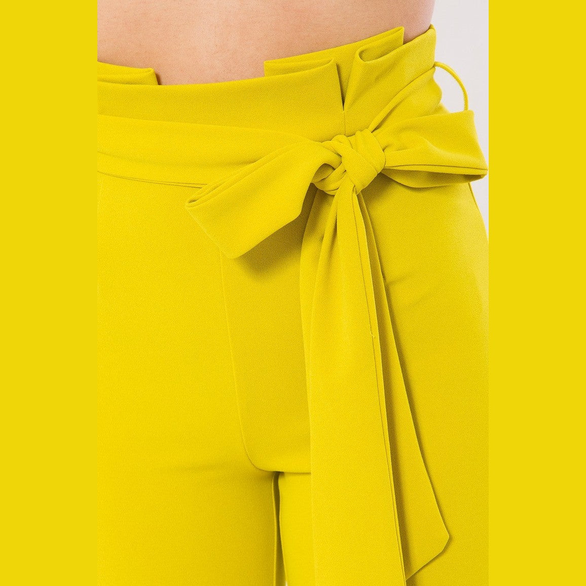 VacationGrabs women's skinny pants with belt accent in bright yellow with a tied bow detail