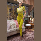 VacationGrabs women's skinny pants with belt accent in bright yellow paired with lace top