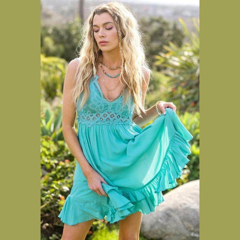 La Miel women's sleeveless summer dress in teal with ruffled hem and intricate detailing