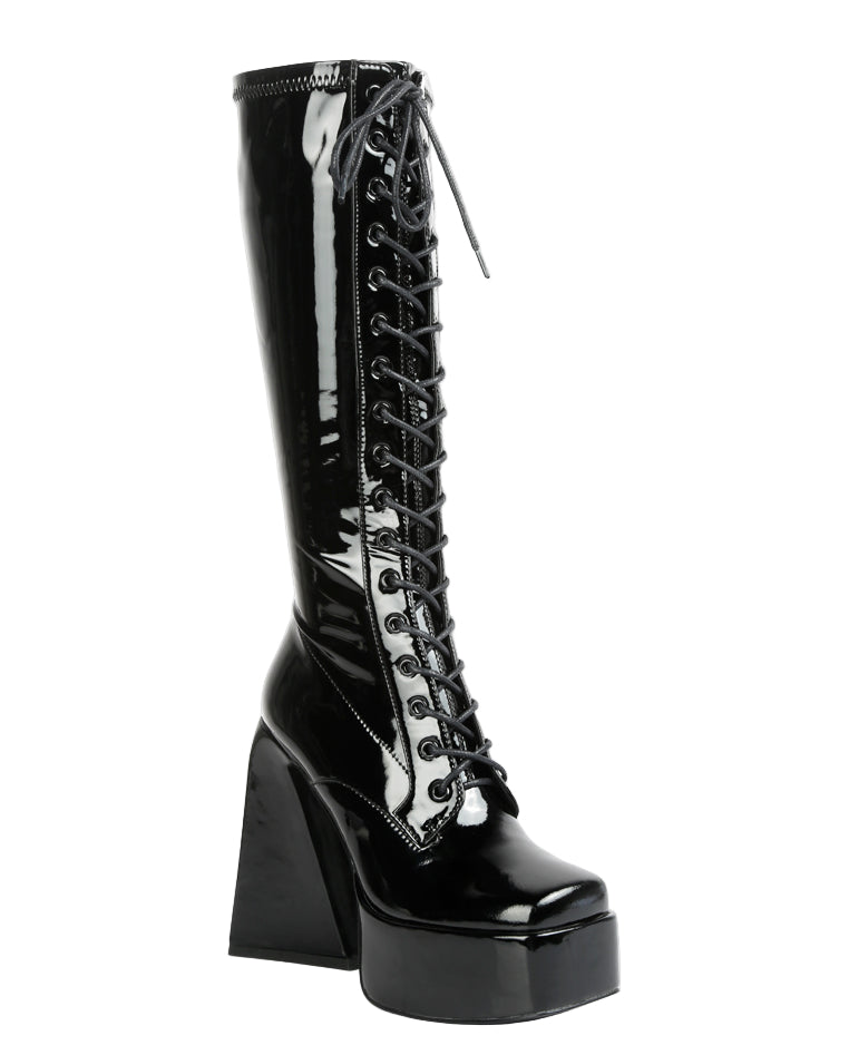 Black platform boot with high heel on a white background