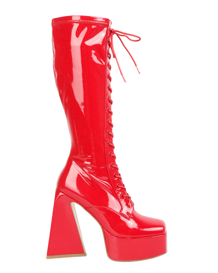 Red high-heeled platform boots on a white background