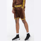 WEIV soft velour athletic shorts in brown with yellow geometric trim on a male model