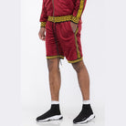 WEIV soft velour athletic shorts in burgundy with yellow Greek key trim worn with matching top