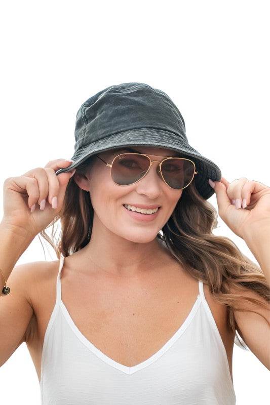 Aili's Corner solid color vacation hat worn by a woman smiling with sunglasses