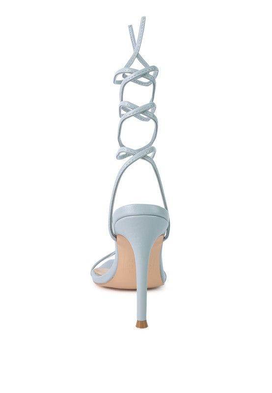 Light blue Sphynx strappy sandals with a high heel and elegant lace-up design for women's fashion