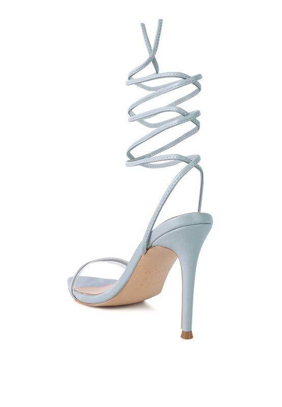 Light blue Rag Company Sphynx strappy sandals with a high heel and spiral straps for elegant summer fashion
