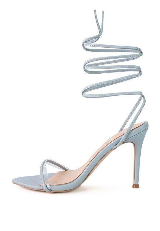 Light blue Sphynx strappy sandals with a high heel and twisted ankle straps for stylish summer wear
