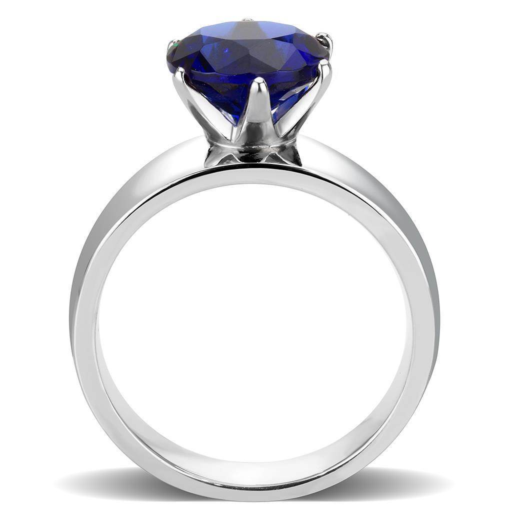Elegant silver statement cocktail ring for women featuring a large blue gemstone