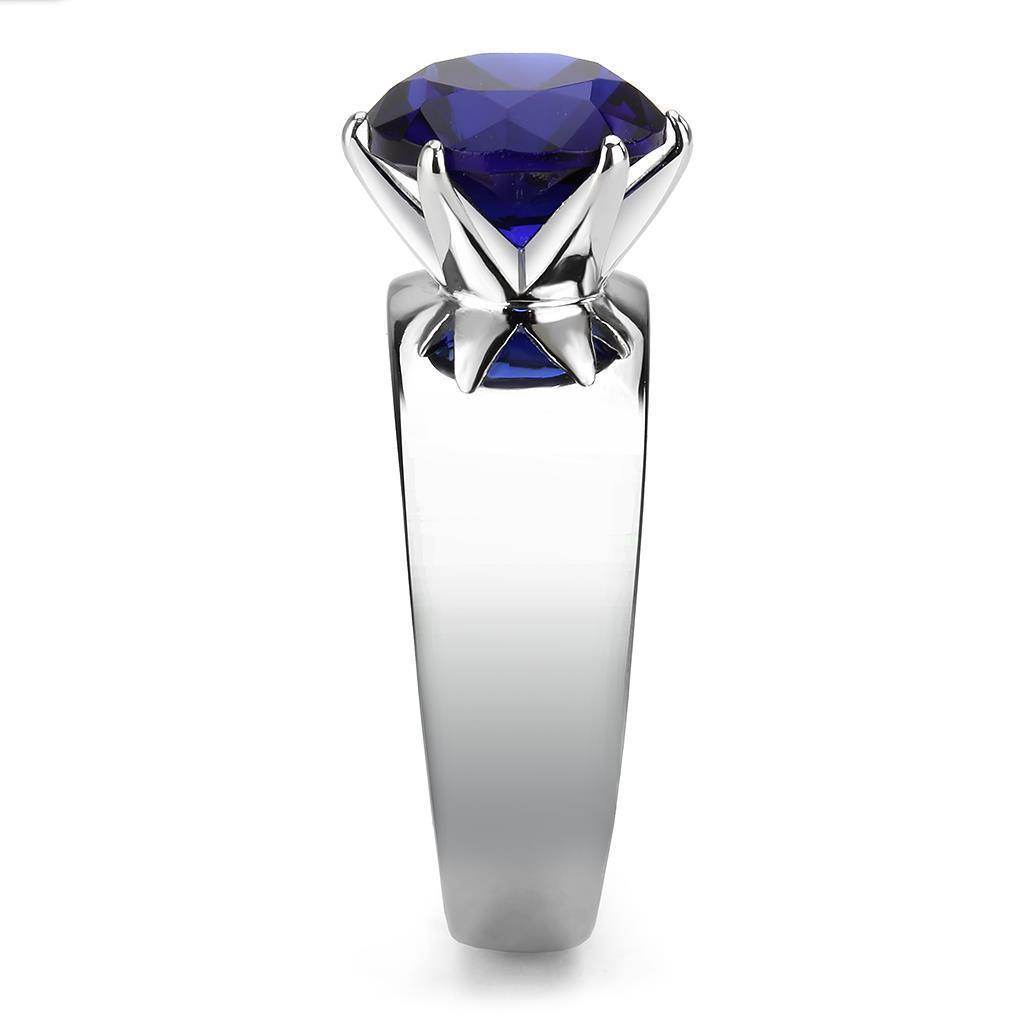 Stylish statement cocktail ring for women featuring a large blue gemstone in a sleek silver setting