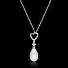 Elegant sterling silver vacation jewelry necklace featuring a heart-shaped pendant and pearl drop