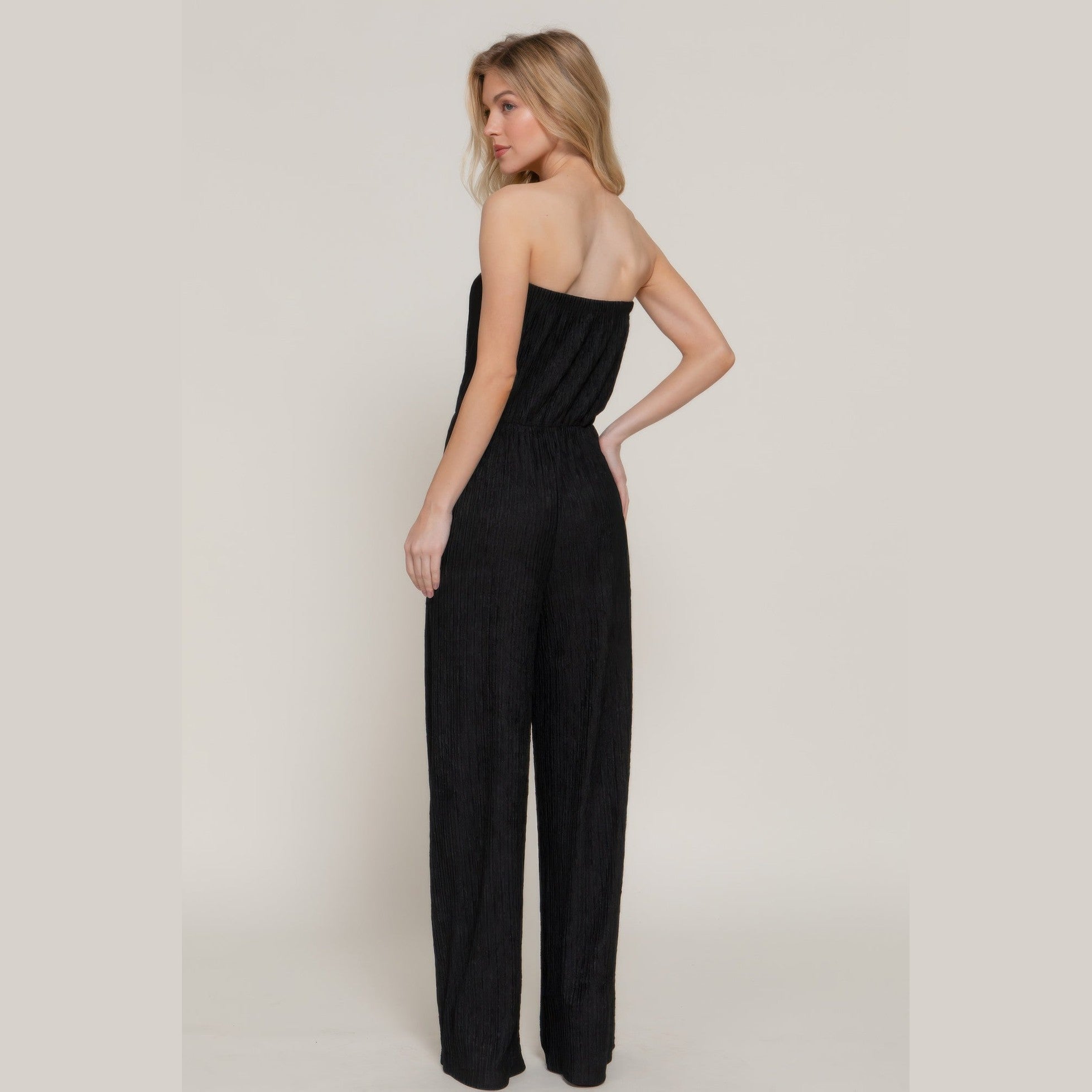 Elegant strapless tube jumpsuit in black with a flattering fit, perfect for chic summer outings