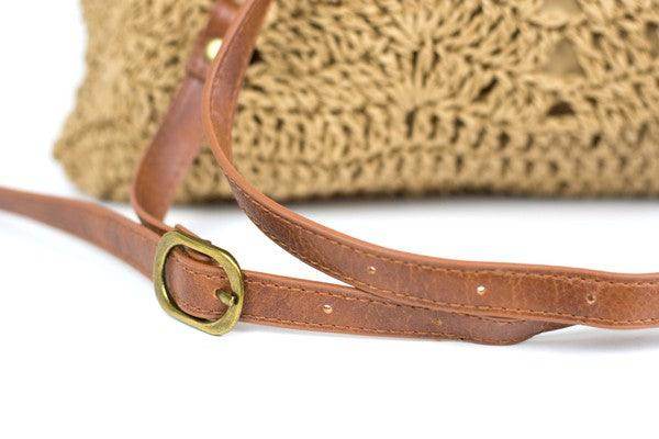Close-up of the strap detail on Aili's Corner straw beach backpack featuring a unique design