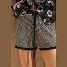 VacationGrabs women's striped knit sweater shorts with black and white horizontal stripes and drawstring waist