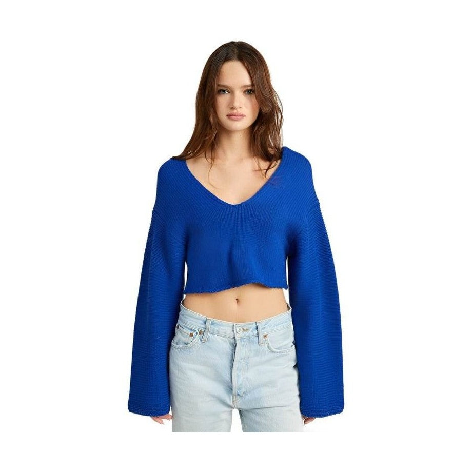 Stylish blue crop top with wide sleeves and a deep v-neck design, perfect for casual outfits