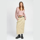 Stylish blue crop top from Emory Park styled with a long skirt and boots