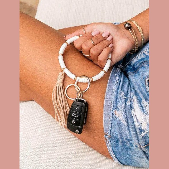 Aili's Corner stylish bracelet key holder with tassel design, perfect for accessorizing and holding keys