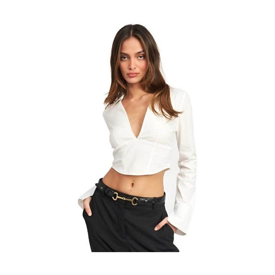Emory Park stylish deep v neck blouse in white, featuring long sleeves and a cropped design.