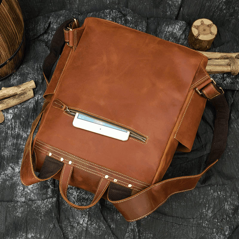Stylish duffel bag for vacation in rich brown leather with a sleek design and convenient zipper pocket