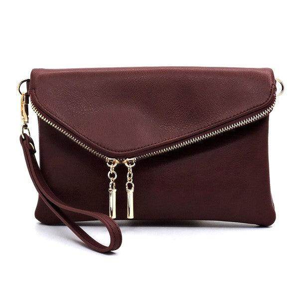 Fashion World stylish handbag for vacation in burgundy with a zip closure and wrist strap