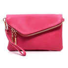 Stylish handbag for vacation in vibrant pink with zipper and wrist strap for easy carrying