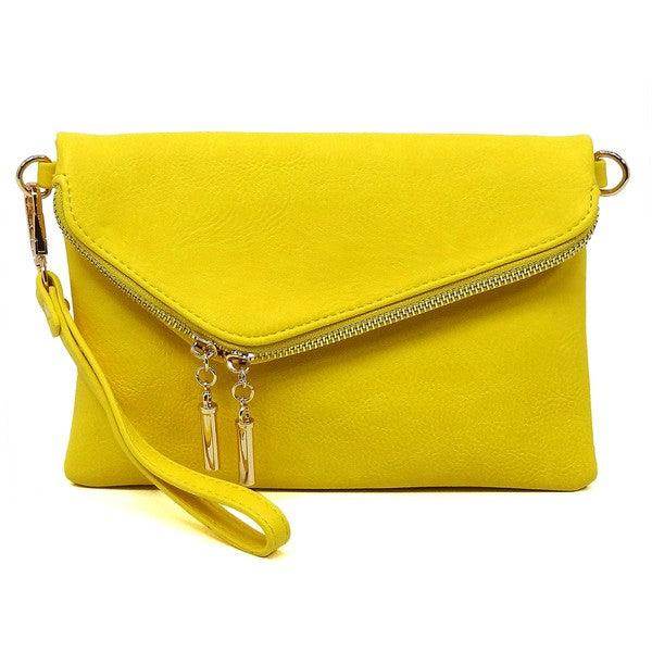 Bright yellow stylish handbag for vacation with a zip closure and wrist strap for easy carrying