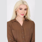 Model wearing stylish hoop earrings by Bella Chic with a chic brown button-up shirt