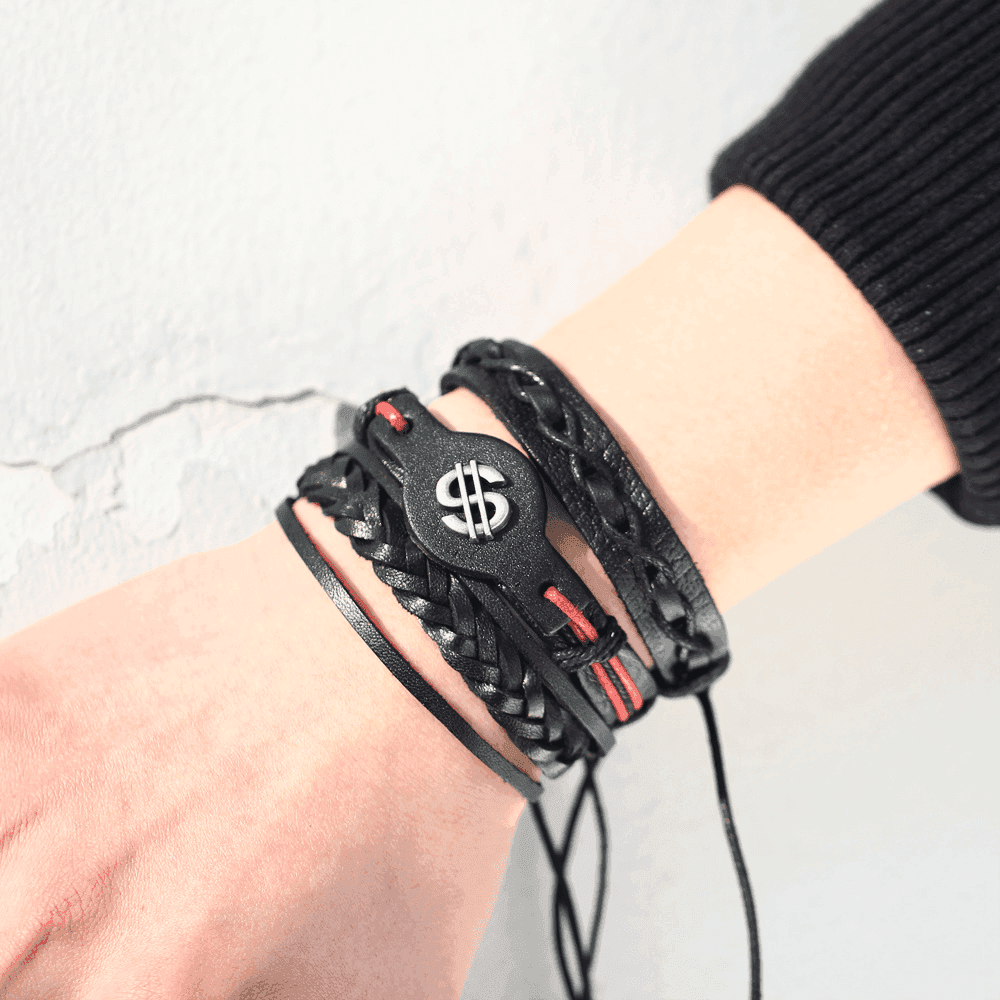 Stylish infinity symbol bracelet on a man's wrist, paired with black woven wristbands for a trendy look